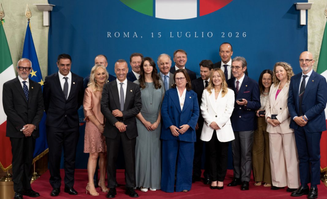 Group of politicians and officials posing on a red carpet during a formal Rome event, July 15, 2026, in front of a blue backdrop.